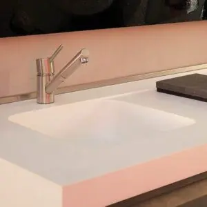 Elegant white countertop and faucet design