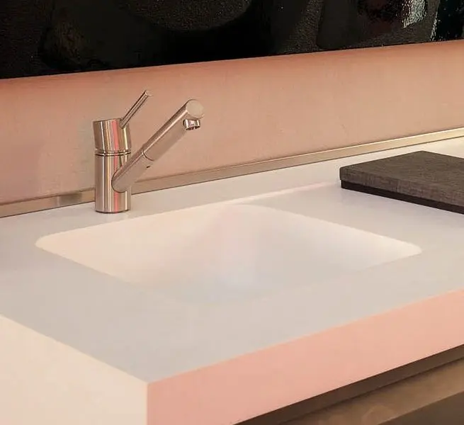 Elegant white countertop and faucet design