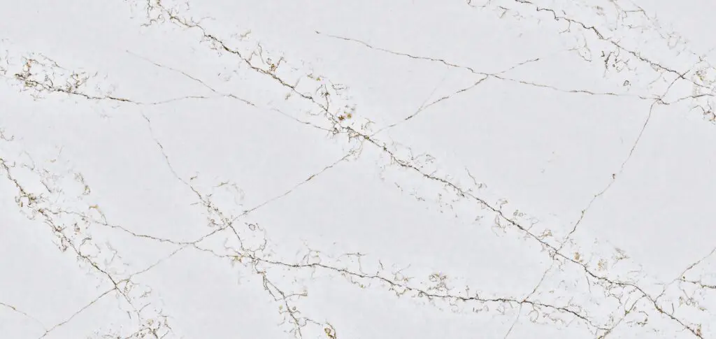 White marble surface with subtle gray and gold veining.