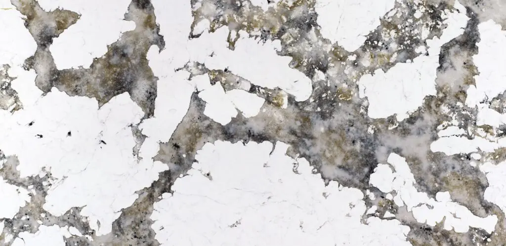 Close-up of white marble with gray and gold veining.
