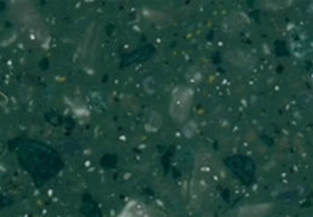 Textured green terrazzo surface close-up