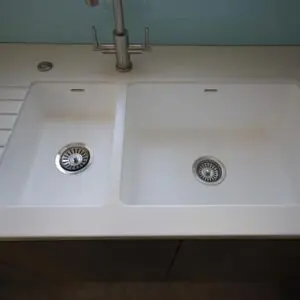 Stainless steel faucet with twin sinks