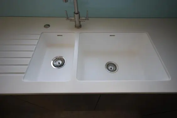 Stainless steel faucet with twin sinks