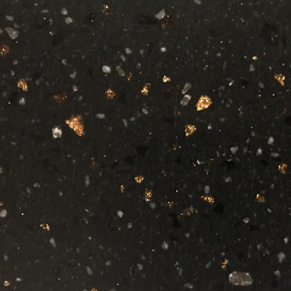 Black stone surface with gold specks