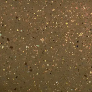 Textured brown surface with colorful specks
