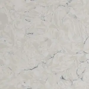 Close-up of a light-colored marble surface with natural veins and texture.