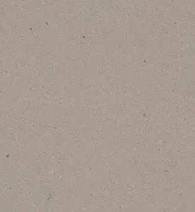 Close-up of textured beige paper with small speckles.