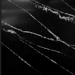 Black marble surface with white diagonal veins